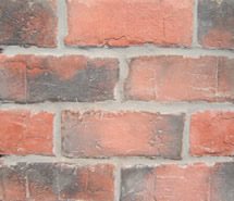 Manufactured stone veneer next to natural stone